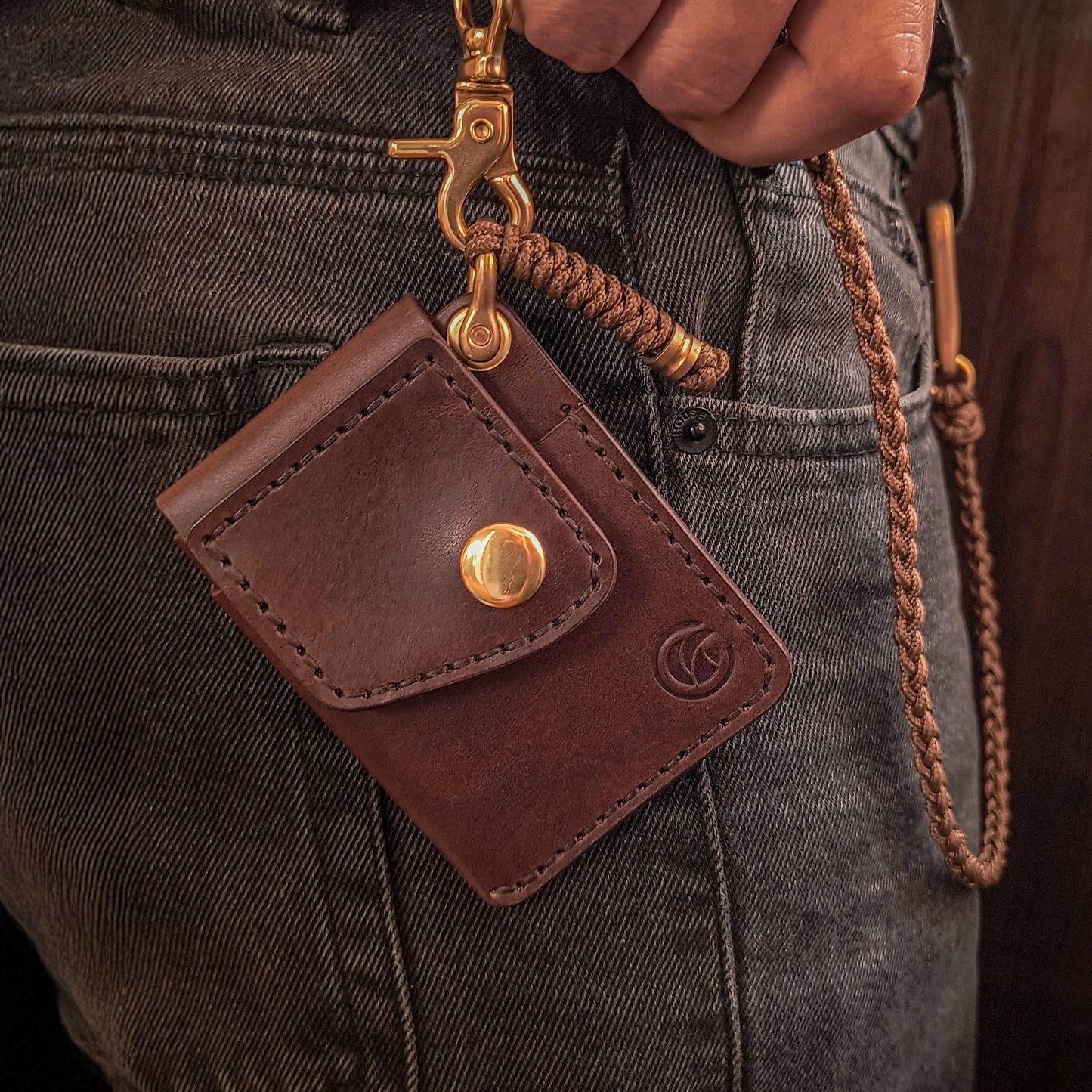 Chocolate brown waxy leather front pocket wallet on fully hand braided cooper-colored paracord lanyard with solid brass hardware 