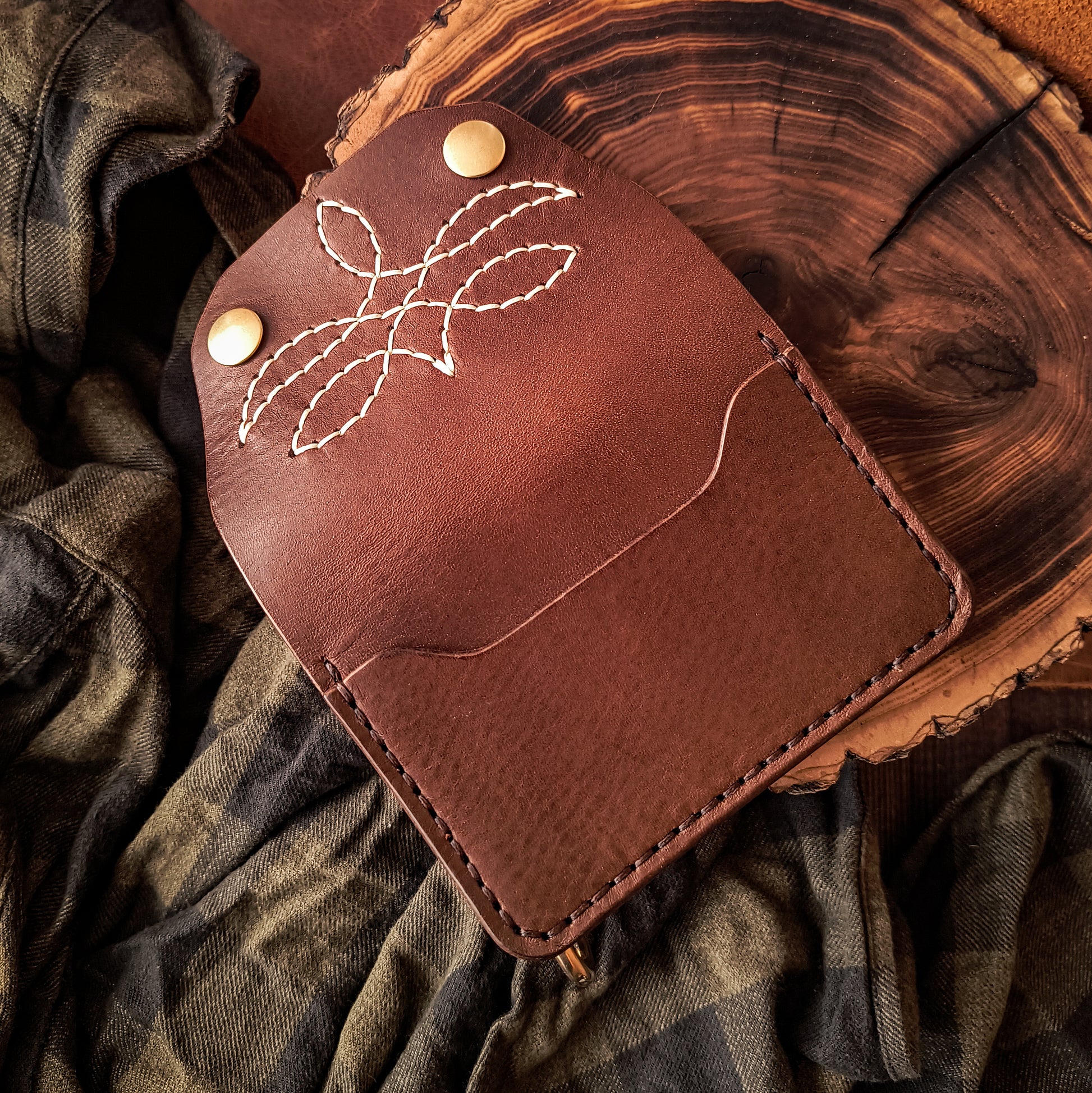Small handmade brown leather biker wallet with decorative pattern 