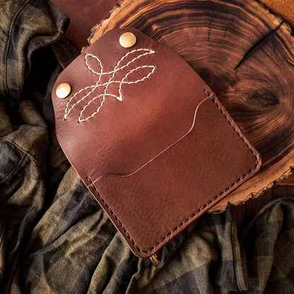 Small handmade brown leather biker wallet with decorative pattern 