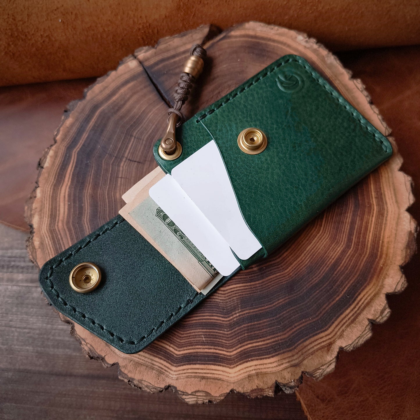 Emerald green textured leather wallet for cards and cash in practical, compact design 