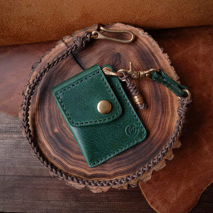 Emerald green leather wallet with fully hand braided cooper-colored paracord lanyard with solid brass hardware 