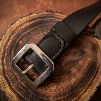 Black chrome tanned leather belt with large stainless steel frame buckle in durable and timeless design 