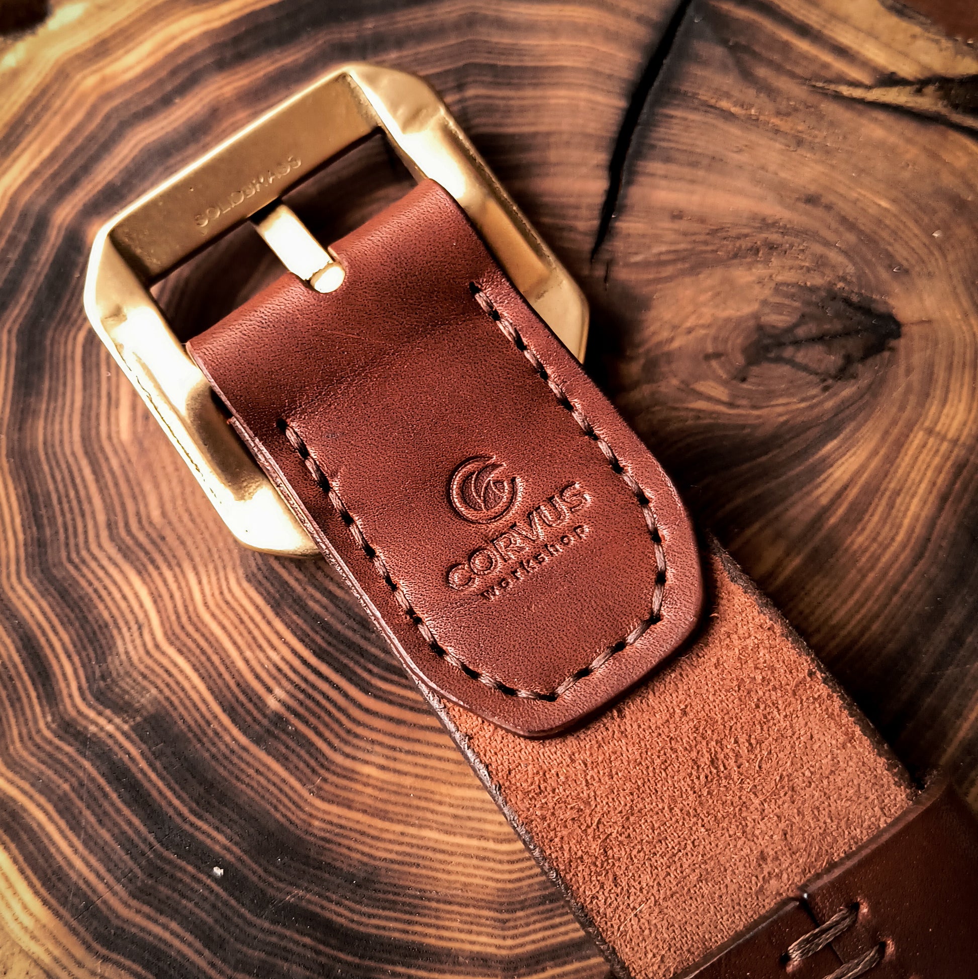 Fully handmade brown leather belt with solid brass frame buckle in simple and rugged design 