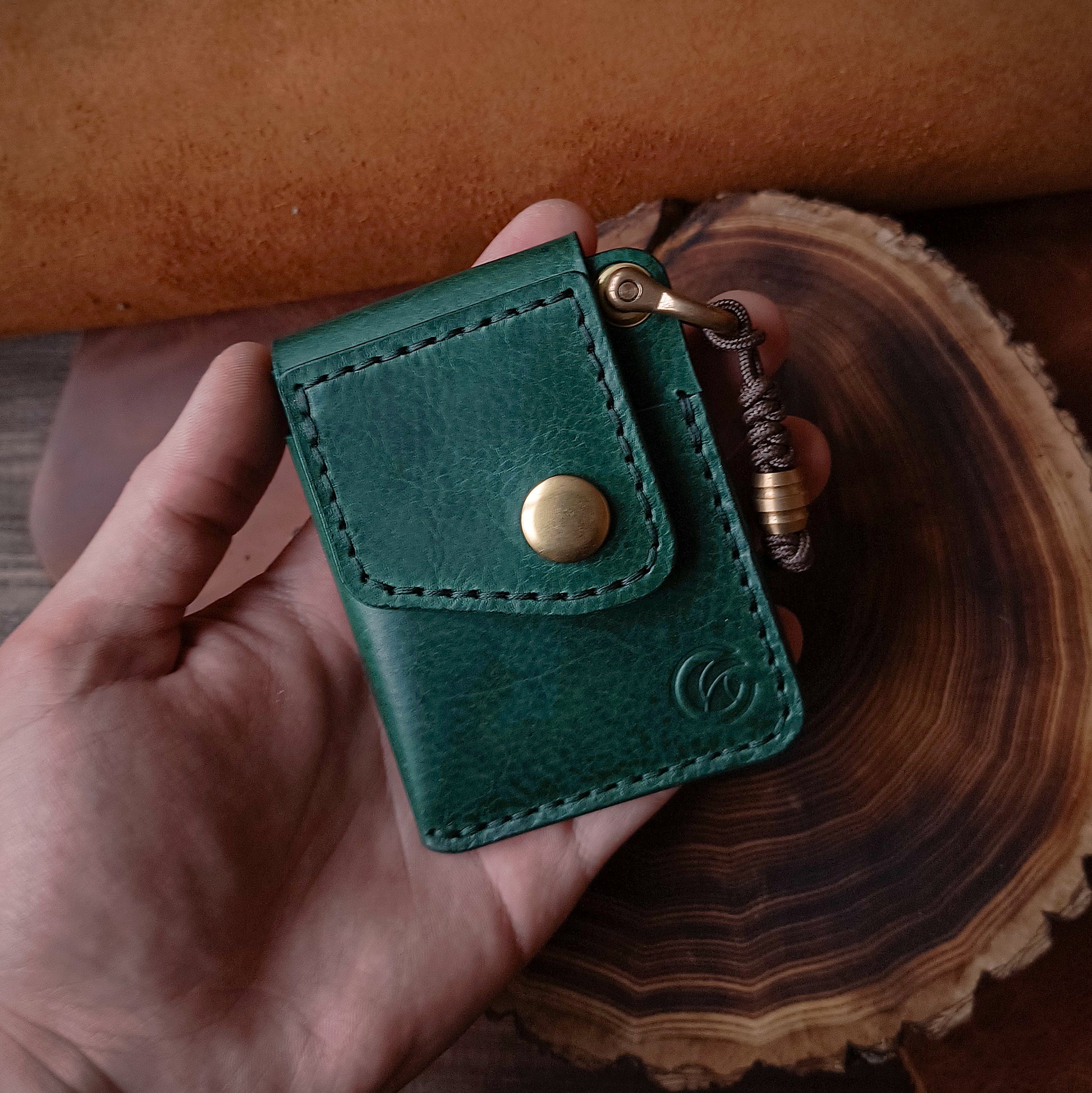 Small and practical textured leather EDC wallet in rich emerald green colour 
