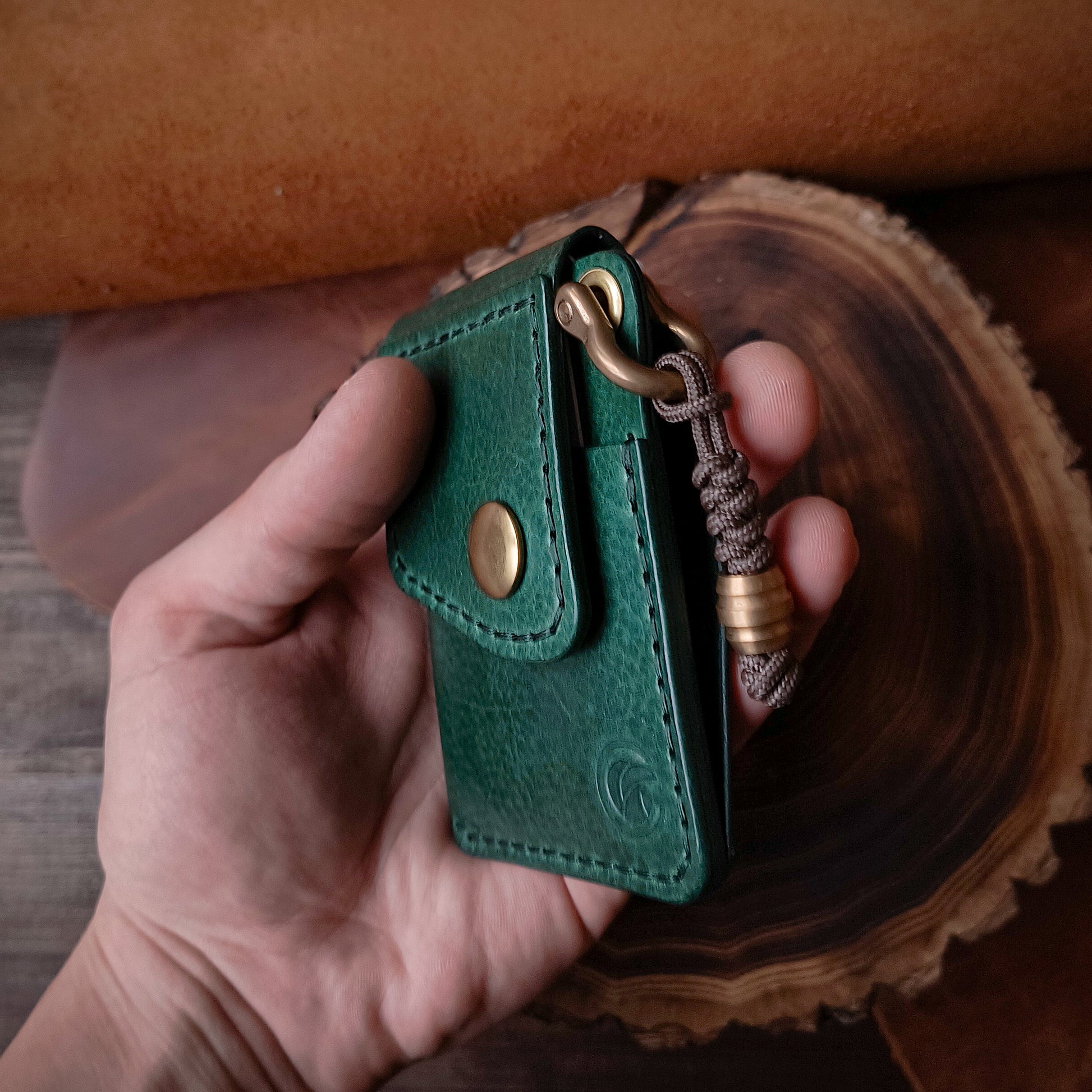 Compact handmade everyday carry wallet in emerald green textured vegetable tanned leather 