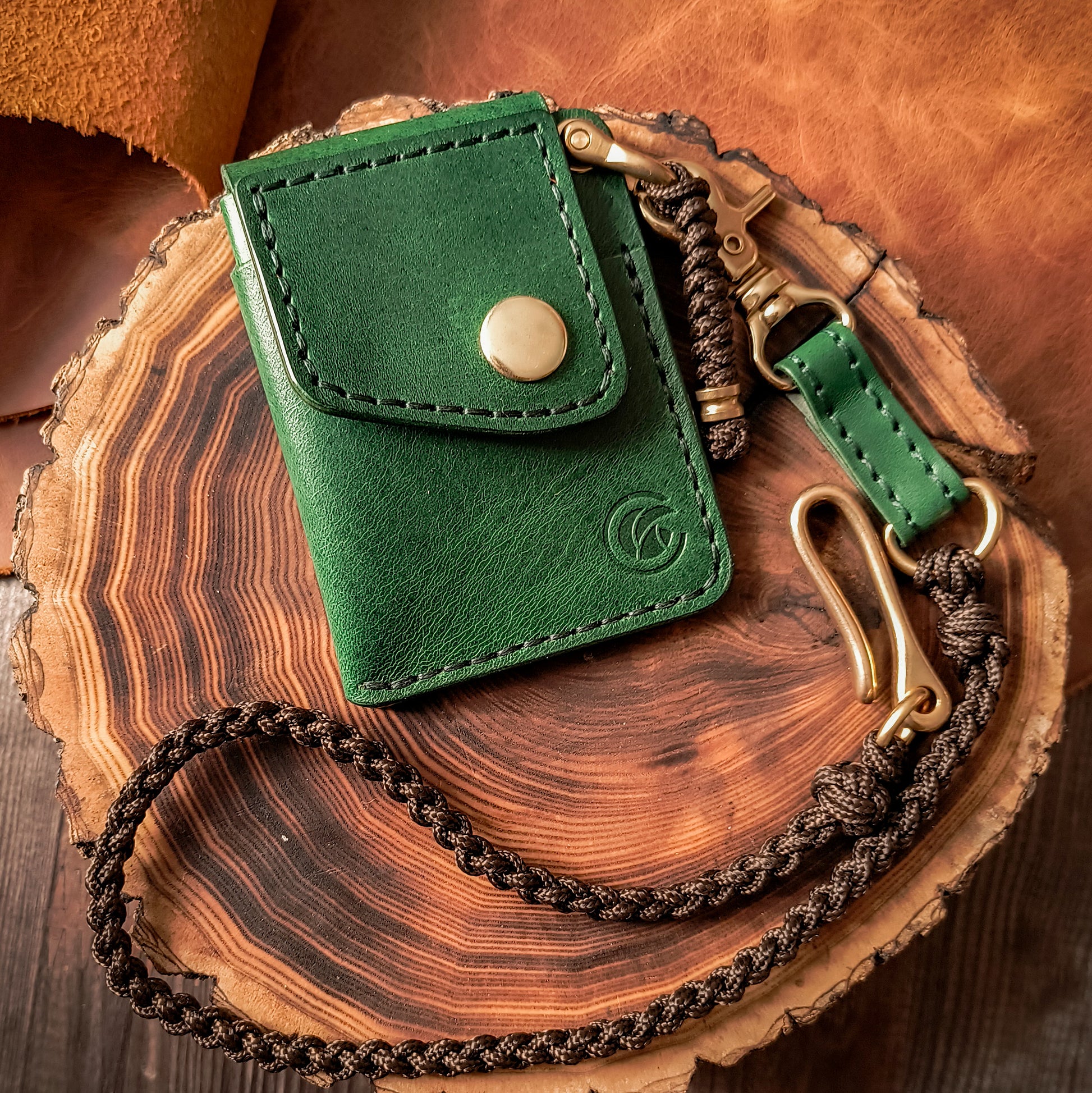 Deep green waxy leather wallet with braided brown paracord lanyard 