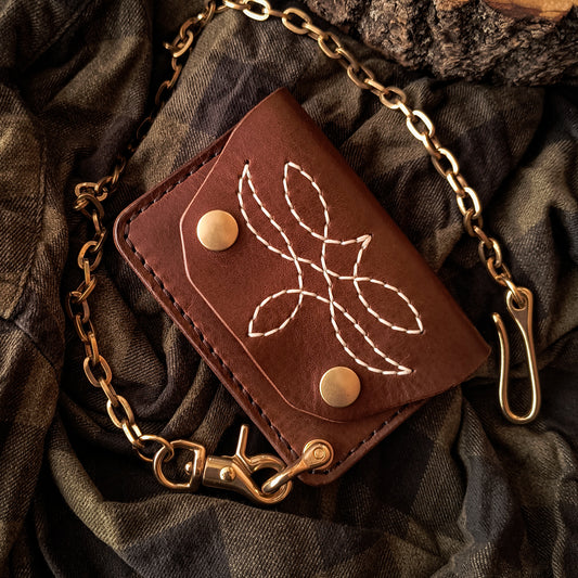 Smallest handmade brown leather trucker wallet with decorative hand-stitched pattern and solid brass chain 